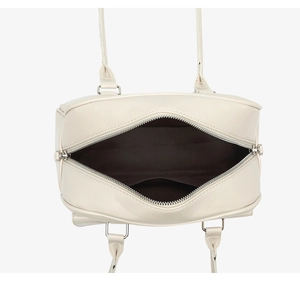 Top view detail of cream oil-wax leather handbag with zipper closure and brown lining