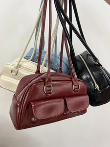 Collection of oil wax leather bowling bags in burgundy, cream, blue, and black colors