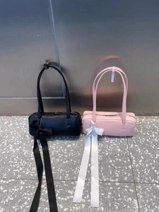 Minimalist rectangular shoulder bag with long silk bow ribbons in black and pink leather