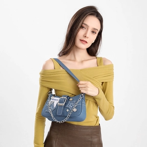 Star embroidered denim shoulder bag with silver chain strap and belt buckle detail