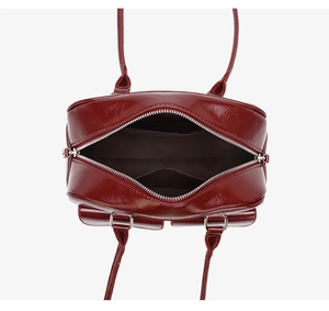 Internal view of burgundy oil-wax leather handbag with zipper and inner pocket