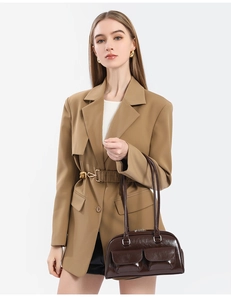 Close-up of vintage brown oil wax leather bowling bag with functional dual front pockets