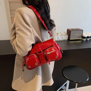Red Y2K patent leather underarm bag with multi-pocket design and silver hardware
