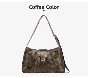 Detail of coffee brown punk tote bag featuring vintage cracked leather and bronze metal buckles