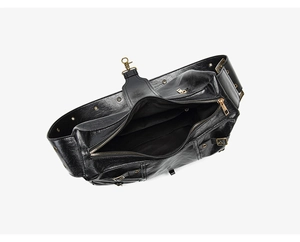 Detail of glossy black punk tote bag showing metallic hardware and spacious interior