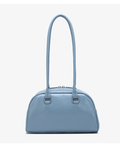 Detail view of smog blue oily leather bowling bag with silver hardware and stitching