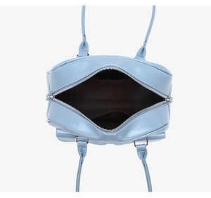 Top view of blue wax leather shoulder bag showing spacious interior and silver zippers