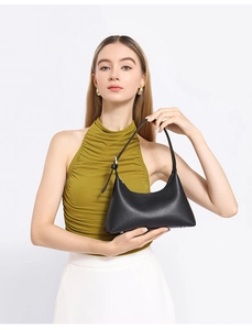 Minimalist black matte leather underarm bag with silver buckle and adjustable shoulder strap