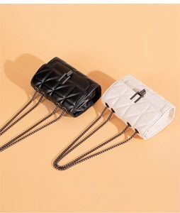 Quilted crossbody bag detail featuring black and beige options with gunmetal chain strap
