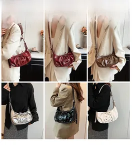 Detail shot of pleated hobo bag with lace-up ribbon design in five stylish colors