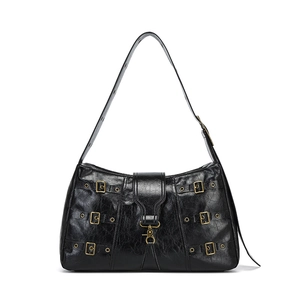 Vintage rock-style black leather tote bag with punk metal buckles and wide shoulder strap