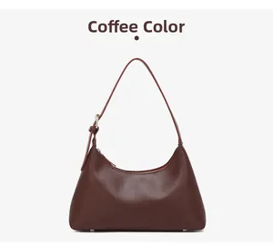 Detailed view of coffee brown leather hobo bag with adjustable strap and silver buckle