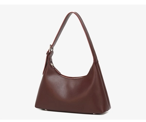 Detailed side view of smooth dark leather hobo bag with silver hardware and precise stitching