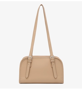 Detail of adjustable silver metal buckles and neat stitching on light brown leather bag