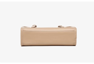 Detailed bottom view of beige leather handbag with neat white contrast stitching craftsmanship