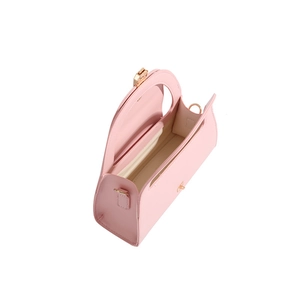 Top view of pink semi-circular handbag showing spacious interior and golden metal clasp