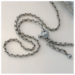 Close-up of the silver quilted leather chain strap with adjustable metal ball buckle