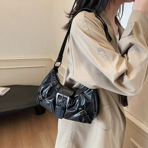 Minimalist black PU leather underarm bag with Y2K ruched design and metal buckle detail