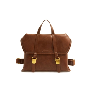 Macro shot of brown retro faux leather bag with gold buckles and white contrast stitching