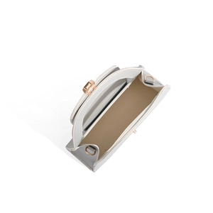 Top view of minimalist semi-circle bag interior showing beige lining and gold hardware