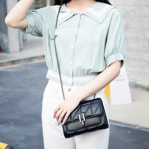 Chic black quilted crossbody chain bag for women with metallic clasp and minimalist style