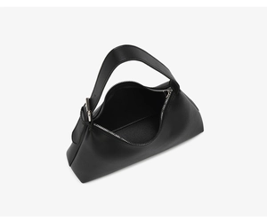 Top view of black minimalist underarm bag showing silver zipper closure and interior space