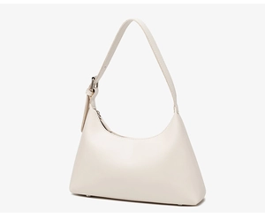 Detail of adjustable strap and silver metal buckle on the minimalist cream underarm bag