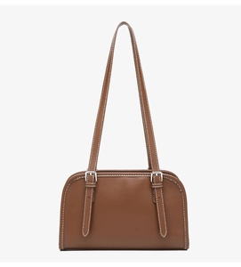 Detail of brown leather shoulder bag with white contrast stitching and silver buckle