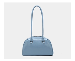 Detail of light blue glossy leather bowling bag featuring silver metallic hardware