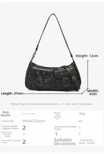 Close-up of vintage grey motorcycle bag with rustic texture and dual buckle pockets