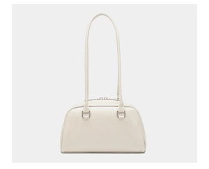 Detail view of cream oil wax leather bowling bag with silver zipper and slim handles
