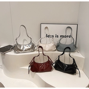 Five assorted colors of drawstring tote bags including metallic silver and denim blue styles