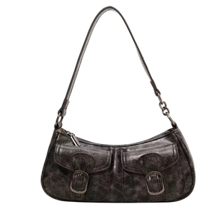 Vintage black cracked leather crescent shoulder bag with metallic chains and pockets