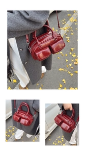 Detailed view of glossy burgundy oil wax leather Boston bag featuring front pockets and straps