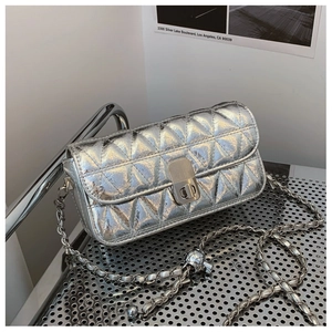 Silver quilted chain bag featuring a metallic finish and rectangular turn-lock closure
