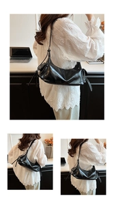 Detail of glossy black patent leather shoulder bag with sleek zip and decorative straps