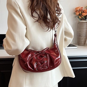 Burgundy pleated ballet-style shoulder bag with bow ribbons and crescent dumpling shape