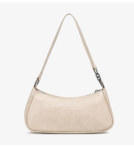 Detail of beige crescent baguette bag featuring grey metal chain and smooth PU texture