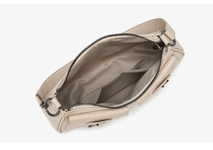 Internal view of beige motorcycle bag showing chevron lining and spacious main compartment