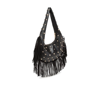 Detail of black leather hobo bag with gold rivets and long fringe tassels on the side