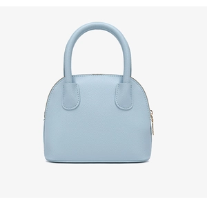 Detailed close-up of light blue litchi grain shell bag featuring high-quality metal zippers