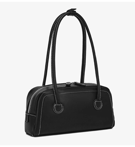 Detail view of black Boston bag featuring contrast white stitching and dual zip closure