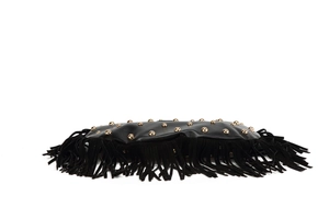 Close-up of black fringe bag with golden rivets and textured bohemian leather details