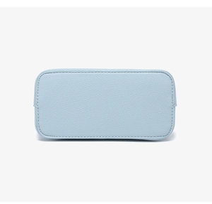 Close-up of baby blue shell bag bottom with neat stitching and litchi grain texture