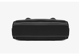 Detailed bottom view of black leather Boston bag with contrast white stitching