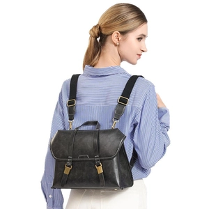 Retro black leather backpack for women with vintage bronze hardware and convertible straps