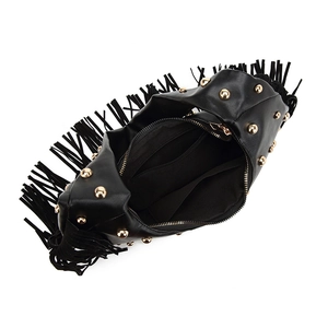 Detail view of the black bohemian fringe bag showing inner zip pocket and lining