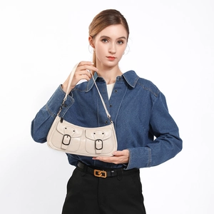 Vintage beige biker style armpit bag with metallic buckle pockets and zip closure