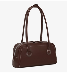 Detail of dark brown vintage Boston bag showing contrast stitching and silver zipper