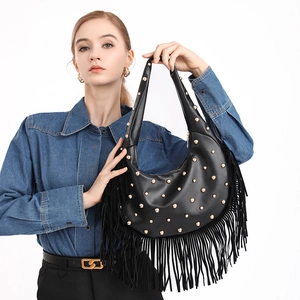 Retro black leather fringe crossbody bag with gold studs in a crescent moon shape